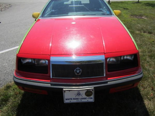 Illustration for article titled For $1,000, This 1989 Chrysler LeBaron Will Let You Clown Around